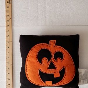 Jack-o’-lantern pumpkin pillow